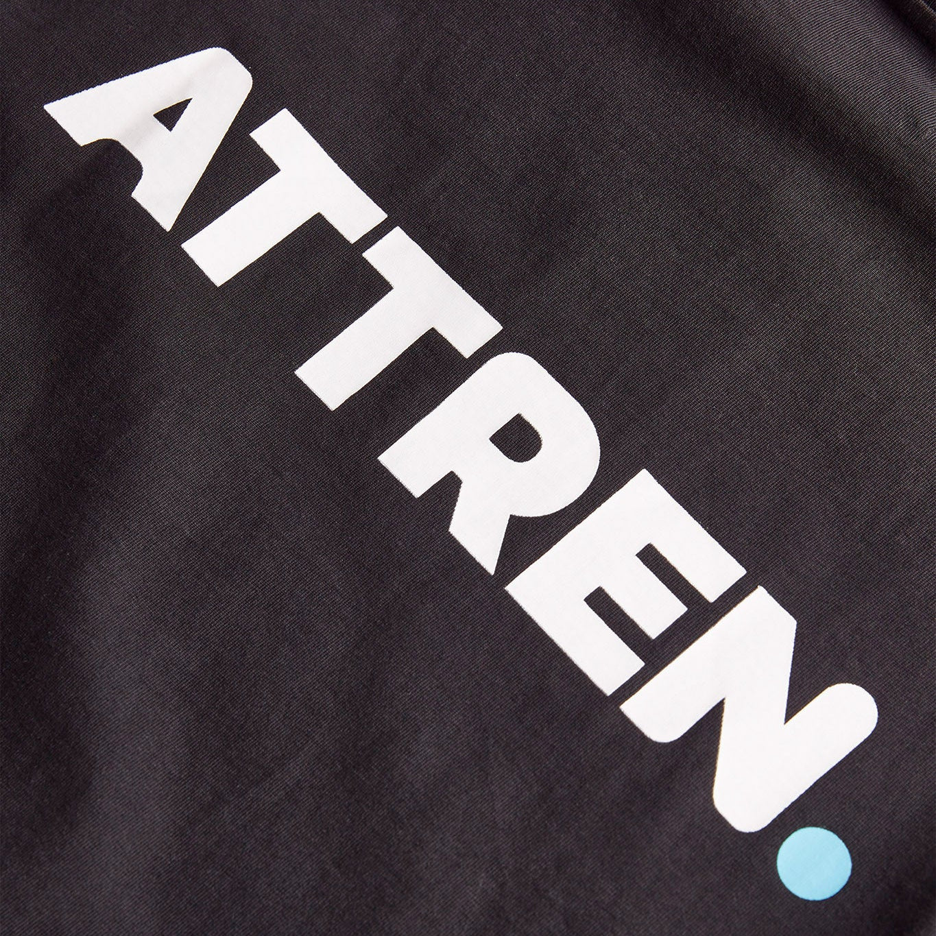 Black T-shirt with 'ATTREN.' logo on a dark background