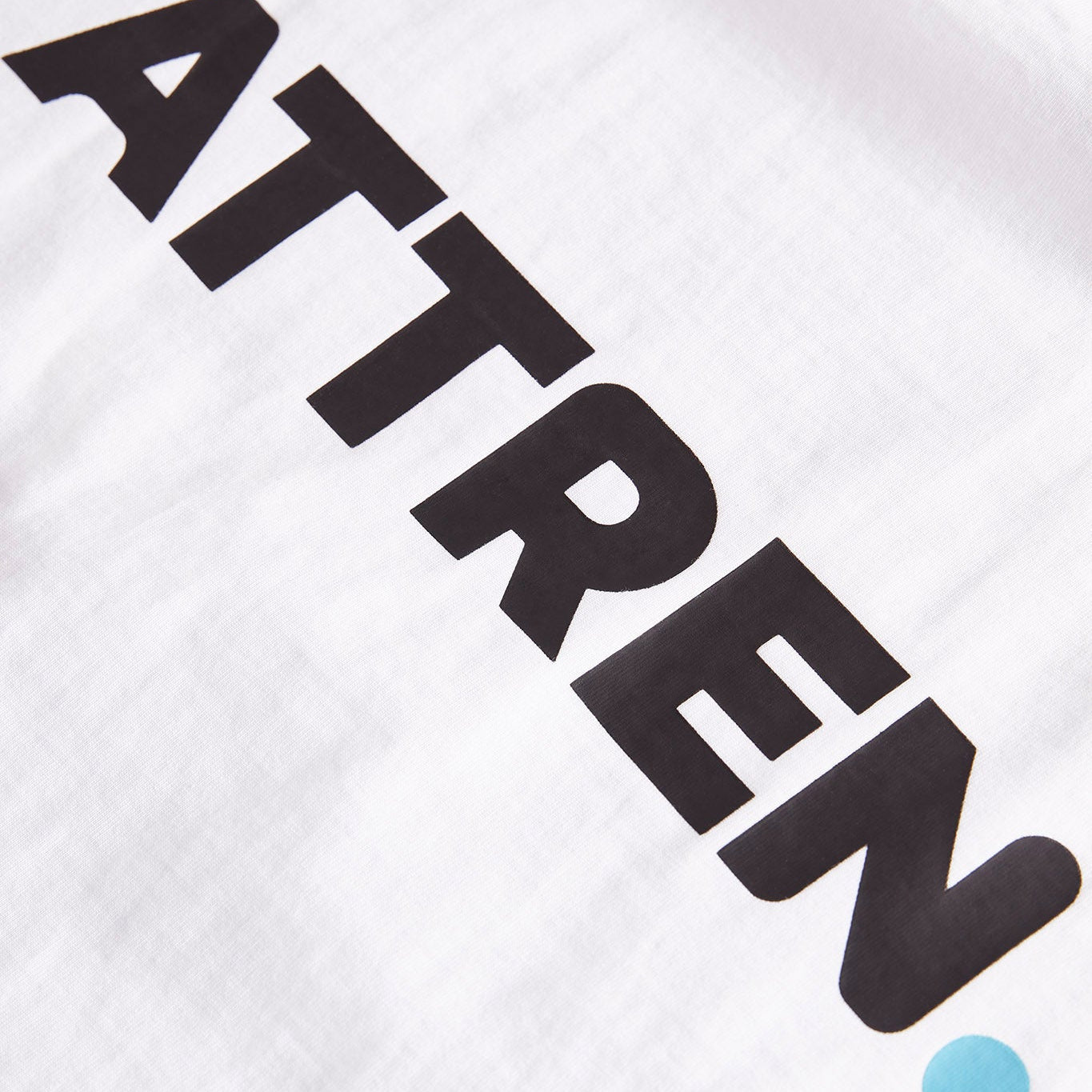 White shirt with black text 'ATTREN' on a white background
